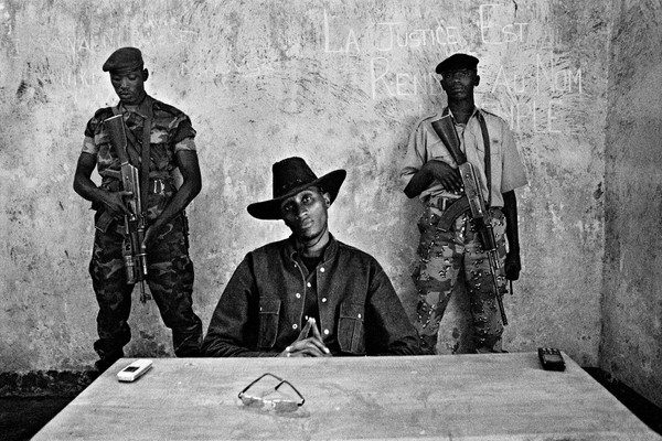 Dissident general Laurent Nkunda, leader of the CNDP (Congrès national pour la défense du Peuple/National Congress for the Defence of the People), poses at his headquarter in his stronghold of Kichanga, Masisi hills in North-Kivu, Democratic Republic of Congo, 2007. Written on the wall: Justice is rendered in the name of the people. République Démocratique du Congo, 2007 Le gÃ©nÃ©ral dissident Laurent Nkunda, pose au quartier gÃ©nÃ©ral du CNDP (congrÃ¨s national pour la dÃ©fense du peuple) Ã  Kichanga au coeur des collines du Masisi dans la province du Nord-Kivu. Au mur, on peut lire :Â la justice est rendue au nom du peuple.