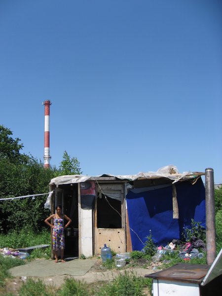 Elvira Azemović in front of the shelter that she and her husband built in Vidikovac after returning to Belgrade from Bojnik, Serbia, June 2012.